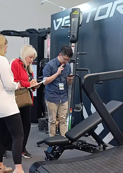 Visitor testing bench adjustment at FIBO 2025