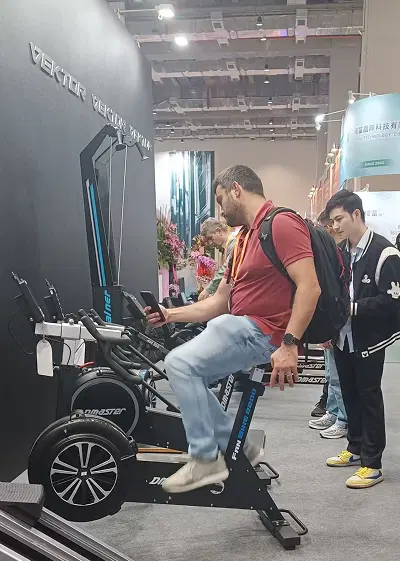 Visitor using fan bike at TAISPO 2025