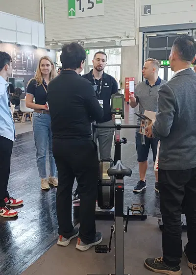 VEKTOR team speaking with visitors at FIBO 2025