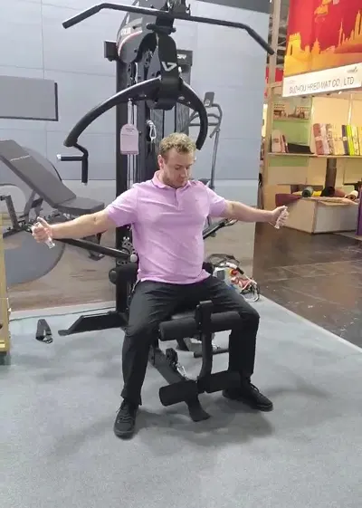 Visitors discussing home gym at ISPO 2025